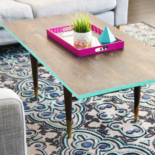 Turn a thrift store coffee table into a modern masterpiece simply by adding a new stained wood top and painting the edge.