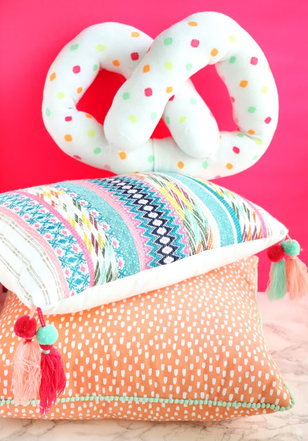 Funfetti Pretzel Pillow Tutorial - Learn how to make a confetti pretzel pillow from a pair of knee socks using only a few simple hand stitches - no sewing machine required!