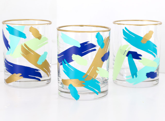 Make your own brushstroke glasses without paint. These DIY abstract art drinking glasses were made using vinyl and a silhouette cameo.