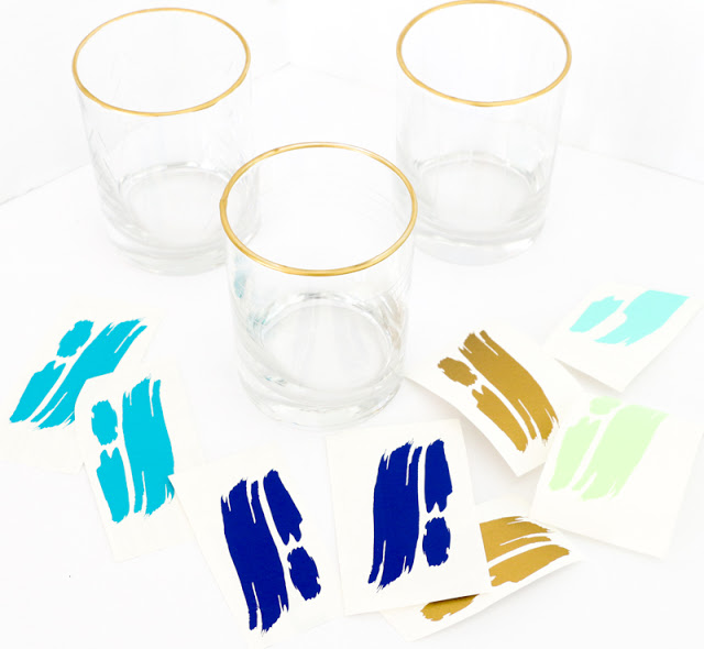 Make your own brushstroke glasses without paint. These DIY abstract art drinking glasses were made using vinyl and a silhouette cameo.