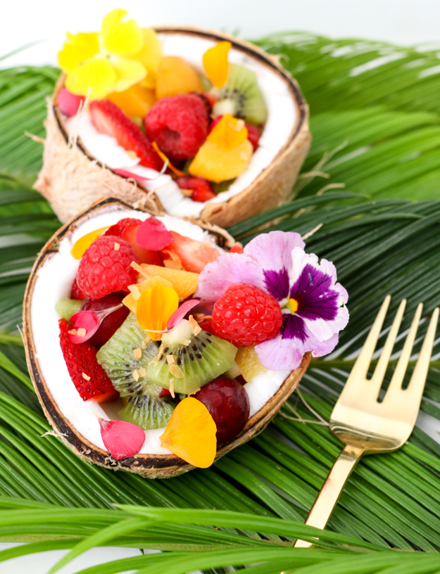 Tropical Fruit Smootie Breakfast Bowl Recipe topped with fresh fruit, chia seeds, hemp seeds, edible flowers, and coconut. These are the perfect easy summer breakfast, great brunch recipe