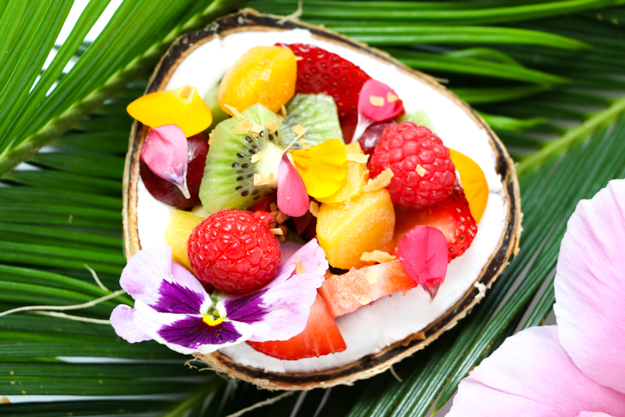 Tropical Fruit Smootie Breakfast Bowl Recipe topped with fresh fruit, chia seeds, hemp seeds, edible flowers, and coconut. These are the perfect easy summer breakfast, great brunch recipe
