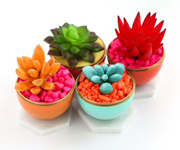 Craft and DIY Mini Neon Succulent Planters using colorful play sand or aquarium rocks and painted succulents in gold edged Easter egg and Marble Planters