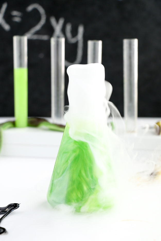 How to make swirling iridescent liquor for Halloween cocktails - cocktail recipe - test tube shots for Halloween party - Halloween party cocktail ideas and recipes - Halloween food recipes - Midori Melon - Luster dust - Dry ice cocktails