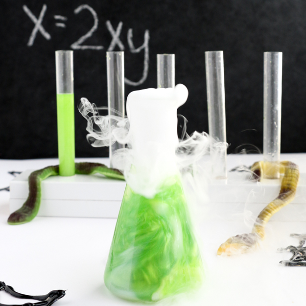 How to make swirling iridescent liquor for Halloween cocktails - cocktail recipe - test tube shots for Halloween party - Halloween party cocktail ideas and recipes - Halloween food recipes - Midori Melon - Luster dust - Dry ice cocktails