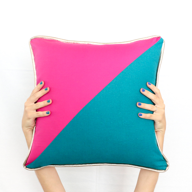 Learn how to sew your own colorblocked triangle pillows with gold piping detail - how to sew - sewing a pillow - fall pillows - jewel tones - sewing - adding piping to pillows - diy - how to - target throw pillows
