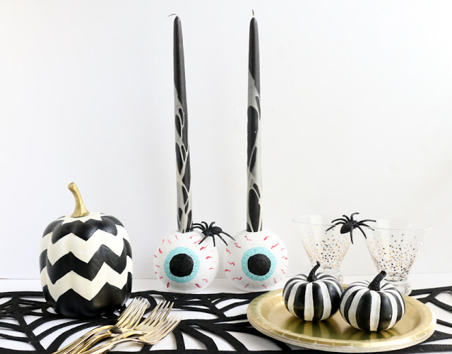 http://www.craftaholicsanonymous.net/spooky-eyeball-candle-holders