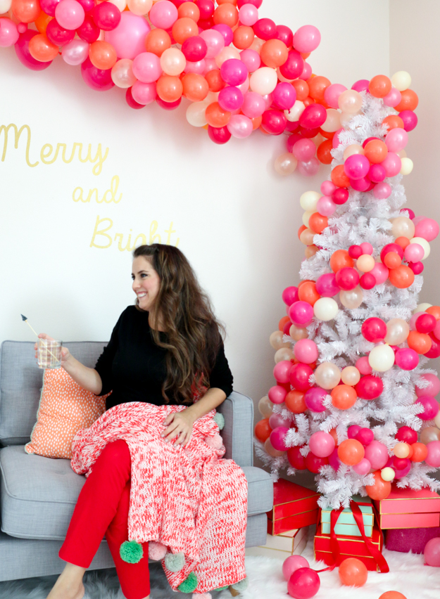 Throw the best, most colorful bubbly Christmas party complete with a balloon filled tree and bubbly bar cart. Holiday party ideas - Christmas party decorations - DIY party decorations